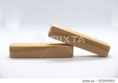 Two wooden blocks on white cover background with customizable space for text or ideas. Copy space Two wooden blocks on white cover background with customizable space for text or ideas. Copy space 95904663