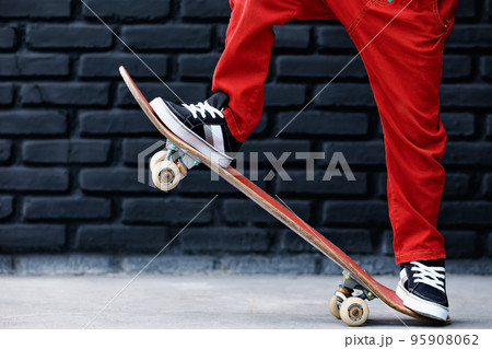Young skater with skateboard have fun at children training class 95908062