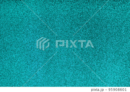 Festive blue glitter christmas background. Glittering surface with glow effect Festive blue glitter christmas background. Glittering surface with glow effect 95908601