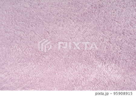 Fluffy pink synthetic fabric background. Soft plush pastel textile texture of winter clothing Fluffy pink synthetic fabric background. Soft plush pastel textile texture of winter clothing 95908915