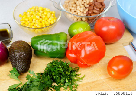 Salad texas caviar. Vegetable dish with corn, beans, pepper, pepper, tomatoes, beans. Served with corn chips nachos Salad texas caviar. Vegetable dish with corn, beans, pepper, pepper, tomatoes, beans. Served with corn chips nachos 95909119