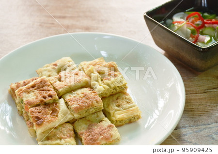 fried chicken Murtabak roti stuffed chicken on plate dipping sweet pickled cucumber sauce fried chicken Murtabak roti stuffed chicken on plate dipping sweet pickled cucumber sauce 95909425