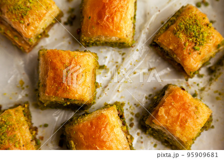 Baklava with pistachio, one of the most beautiful desserts of Turkish cuisine, Turkish baklava in the package Baklava with pistachio, one of the most beautiful desserts of Turkish cuisine, Turkish baklava in the package 95909681