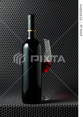 Bottle and glass of red wine. Bottle and glass of red wine. 95909844