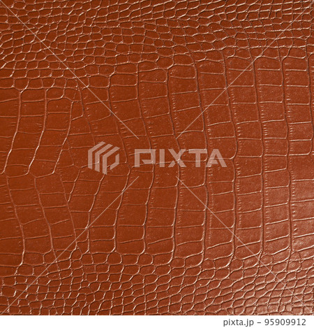 Very luxurious brown crocodile skin texture used in textile industry 95909912