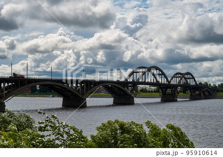 City bridge across the river with metal arches City bridge across the river with metal arches 95910614