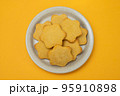butter cookies isolated on light brown plate 95910898