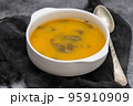 vegetable soup with crackers in white bowl on ceramic 95910909