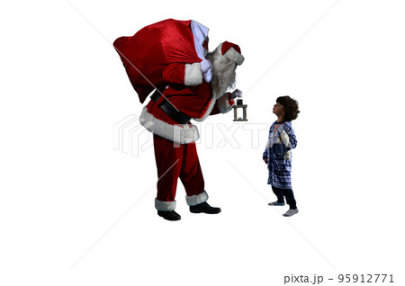 Santa claus is giving a present for christmas to a little boy 95912771