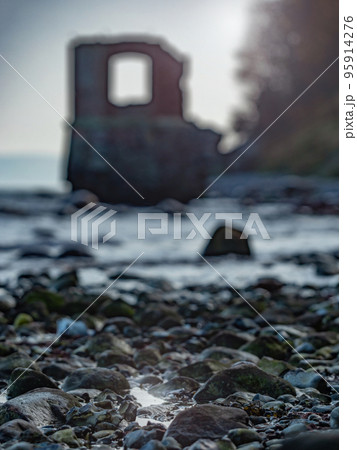 Ruins of the old gauge tower on shore bellow Cape Arkona cliff Ruins of the old gauge tower on shore bellow Cape Arkona cliff 95914276