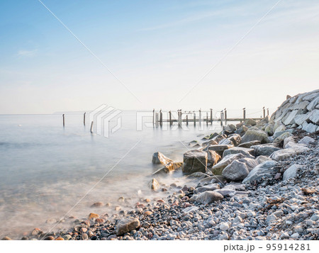 Pillars and poles of port mole in fishing Village of Vitt near Kap Arkona Pillars and poles of port mole in fishing Village of Vitt near Kap Arkona 95914281