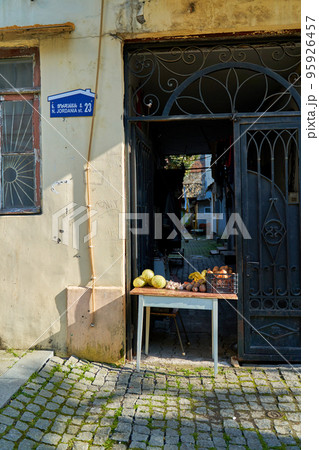 A vegetable trade counter is equipped at the entrance to the courtyard of a residential building A vegetable trade counter is equipped at the entrance to the courtyard of a residential building 95926457