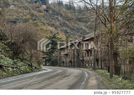 Abandoned crumbling buildings in a residential city. A dying city. Frightening atmosphere 95927777
