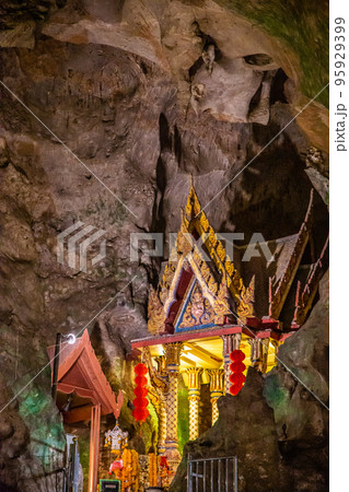 Wat Suwan Khuha temple in the cave with buddha statues, in Phang Nga, Thailand Wat Suwan Khuha temple in the cave with buddha statues, in Phang Nga, Thailand 95929399