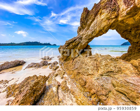 Koh Phayam beach Hin Talu with rock arch formation in Ranong, Thailand. Koh Phayam beach Hin Talu with rock arch formation in Ranong, Thailand. 95930859