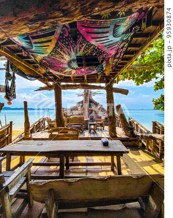 Old wooden pirate boat on the beach in Koh Phayam, Ranong, Thailand Old wooden pirate boat on the beach in Koh Phayam, Ranong, Thailand 95930874