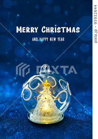 Glass ball with a glowing Christmas tree inside Glass ball with a glowing Christmas tree inside 95932644