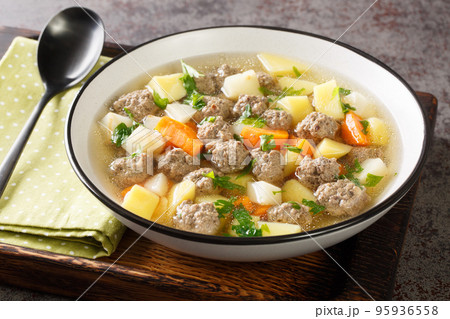 Sodd is a traditional Norwegian soup like meal with mutton, meatballs, potatoes and carrots closeup in the plate. Horizontal Sodd is a traditional Norwegian soup like meal with mutton, meatballs, potatoes and carrots closeup in the plate. Horizontal 95936558
