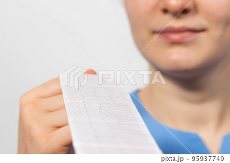 The cardiologist shows the film of an electrocardiogram of a patient with acute myocardial infarction The cardiologist shows the film of an electrocardiogram of a patient with acute myocardial infarction 95937749