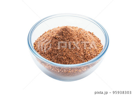 Spices in glass bowl isolated on white background. Seasoning for cooking. 95938303