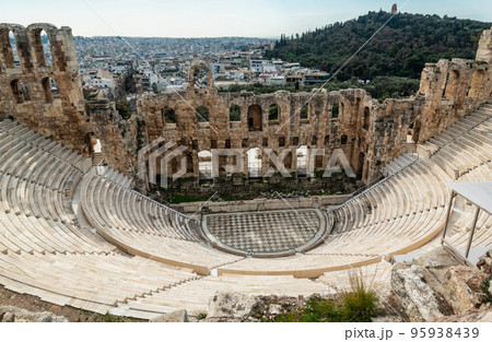 ancient theater on the background of Athens Greece 95938439