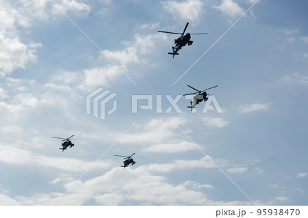 Boeing AH-64 attack helicopters on formation during an air show. Greek Air Force Apache flying on Thessaloniki, Greece during the 28 October National Oxi Day parade. 95938470