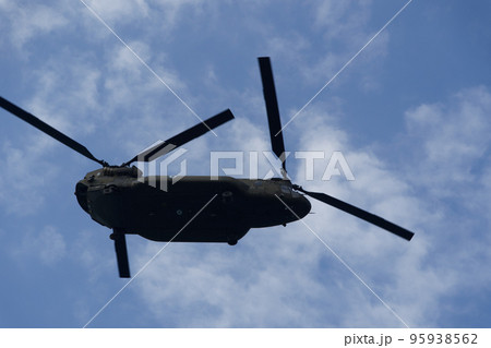 Boeing CH-47 Chinook during an air show. Greek Air Force twin-engine lift helicopter flying on Thessaloniki, Greece during the 28 October National Oxi Day parade. 95938562