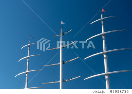 several masts of a yacht without sails several masts of a yacht without sails 95938756