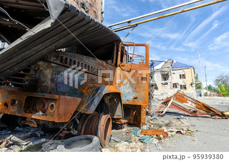 burnt military armored car on the street of the ruined city burnt military armored car on the street of the ruined city 95939380