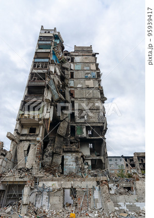 destroyed and burned houses in the city during the war in Ukraine destroyed and burned houses in the city during the war in Ukraine 95939417