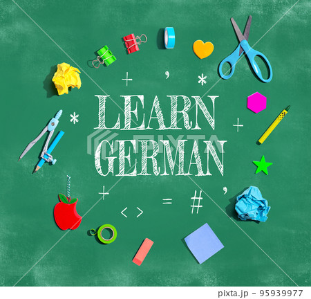 Learn German theme with school supplies on a chalkboard 95939977