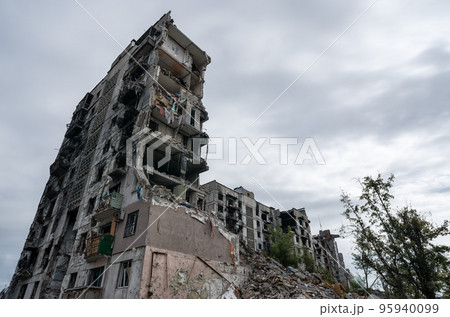destroyed and burned houses in the city during the war in Ukraine destroyed and burned houses in the city during the war in Ukraine 95940099