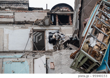 destroyed and burned houses in the city during the war in Ukraine 95940153
