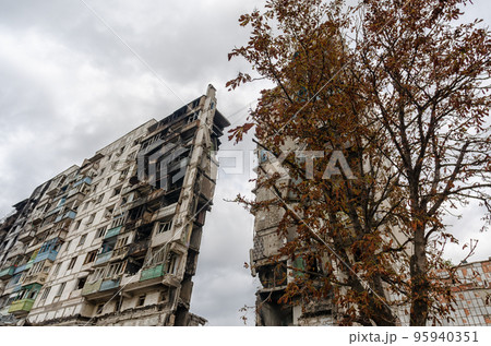 destroyed and burned houses in the city during the war in Ukraine 95940351