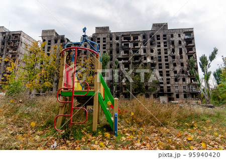 destroyed and burned houses in the city during the war in Ukraine 95940420