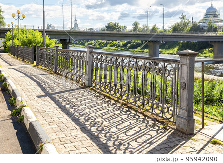 Shadow from the city decorative grating on the pavement in Torzhok city, Russia Shadow from the city decorative grating on the pavement in Torzhok city, Russia 95942090