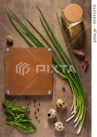 Green onion chives and eggs at table background. Cooking concept and salad ingredients 95943359
