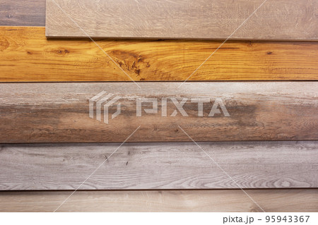 Laminate wooden floor background texture. Wood laminate stack Laminate wooden floor background texture. Wood laminate stack 95943367