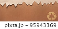 Cardboard torn edge and recycle symbol on paper background texture. Brown ripped paper 95943369