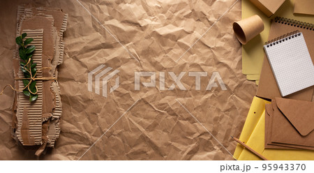 Cardboard torn edge and brown ripped paper on chipboard plywood background. Recycling concept Cardboard torn edge and brown ripped paper on chipboard plywood background. Recycling concept 95943370