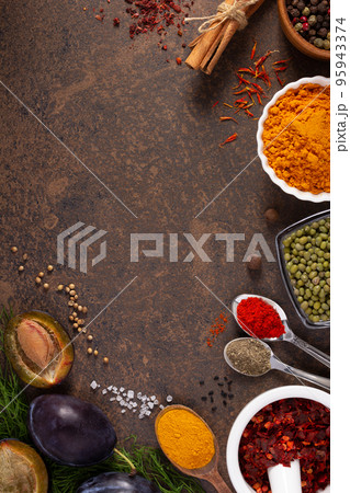 Variety of spices and herbs at table background. Cooking concept and ingredients Variety of spices and herbs at table background. Cooking concept and ingredients 95943374