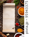 Variety of spices and herbs with cookbook paper at table background 95943375