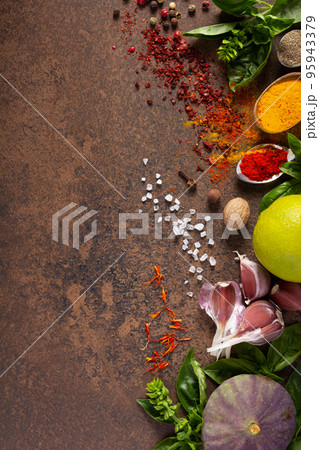 Variety of spices and herbs at table background. Cooking concept and ingredients Variety of spices and herbs at table background. Cooking concept and ingredients 95943379