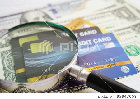 Credit card and magnifying glass for online shopping, security finance business concept. 95947008