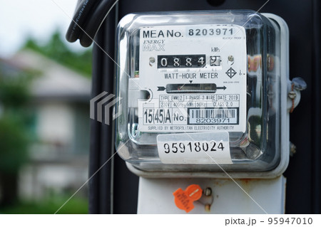 Bangkok, Thailand - May 15, 2022 Electric measuring power meter for energy cost at home and office. Bangkok, Thailand - May 15, 2022 Electric measuring power meter for energy cost at home and office. 95947010