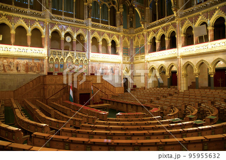 BUDAPEST, HUNGARY - 03 MAR 2019: Interior of the Budapest Parliament building and the meeting room of the Hungarian government with a lot of wood applications BUDAPEST, HUNGARY - 03 MAR 2019: Interior of the Budapest Parliament building and the meeting room of the Hungarian government with a lot of wood applications 95955632