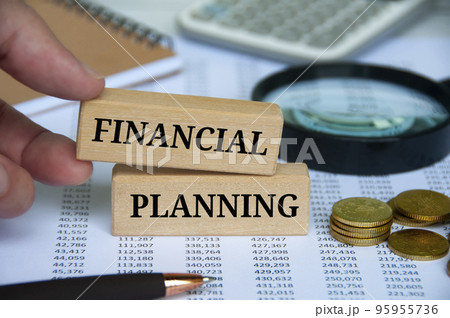 Financial planning text on wooden blocks with office table background. Business planning concept. 95955736