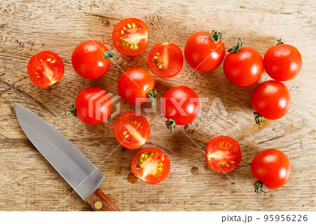 Fresh tomatoes on wooden table. Fresh tomatoes on wooden table. 95956226