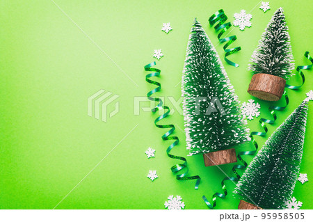 Flat lay composition with christmas trees on color background. Top view with copy space 95958505