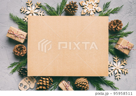Flat lay Christmas composition. square Paper blank, pine tree branches, christmas decorations on Colored background. Top view, copy space for text Flat lay Christmas composition. square Paper blank, pine tree branches, christmas decorations on Colored background. Top view, copy space for text 95958511